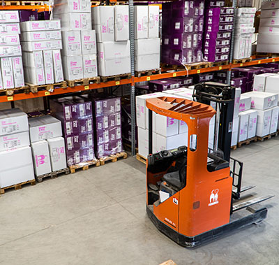 boxes and a forklift in a warehouse