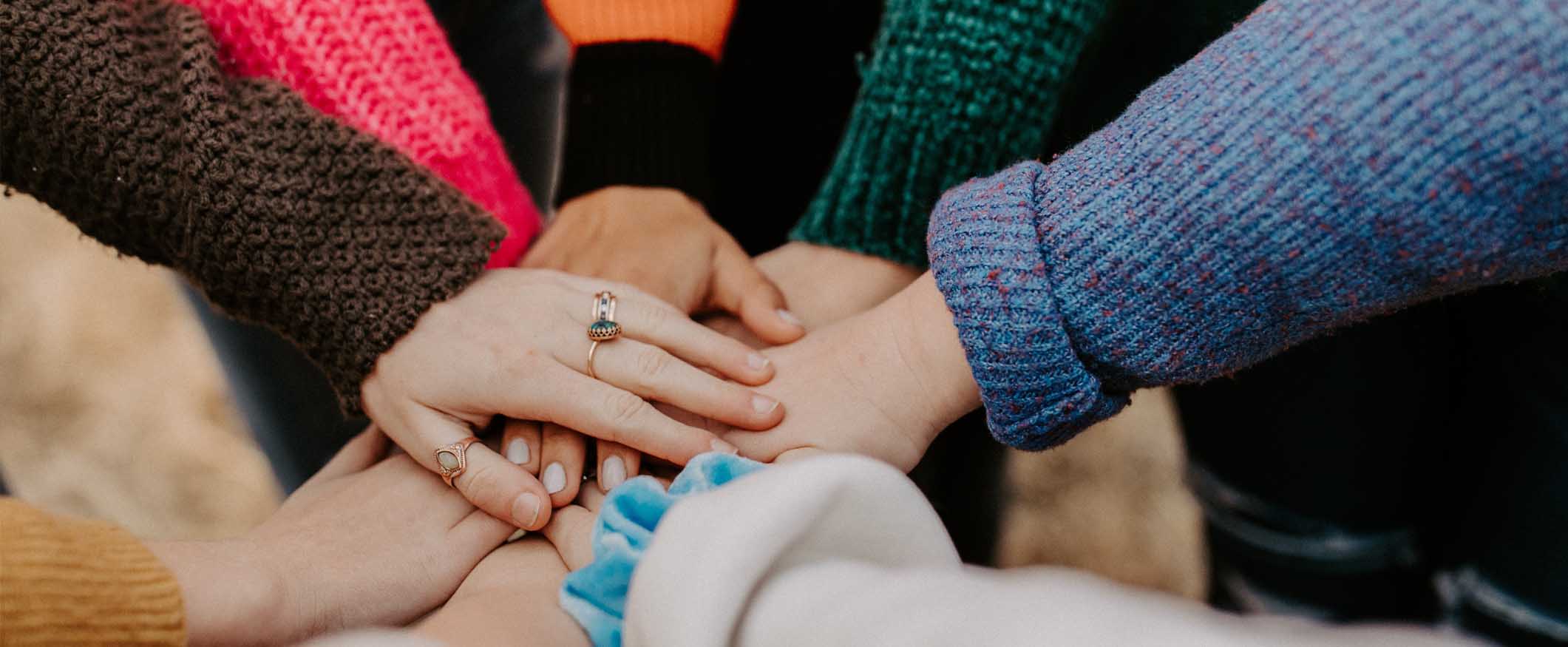all in for join us page A group of women's hands